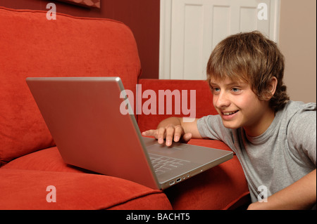 Boy using a laptop computer Stock Photo