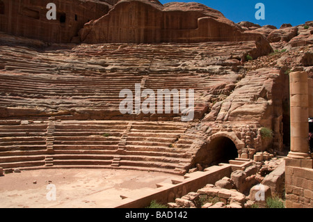 View of ancient Roman theater cut out of solid rock into the side of the mountain in the ancient Nabatean city of Petra Jordan Stock Photo