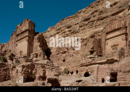 View of the Aneisho and Uneishu rock cut Tombs carved into cliff face in the ancient Nabatean city of Petra Jordan Stock Photo