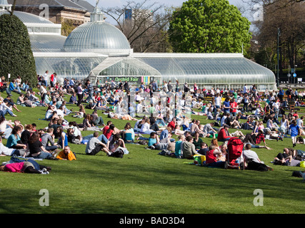 Crowds of people enjoy a beautiful spring day at the Botanic Gardens in Glasgow. Stock Photo