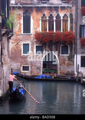 Gondola on Rio dei Barcaroli Hotel San Moise and flower decked windows in background San Marco sestier Venice Veneto Italy Stock Photo