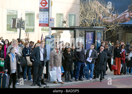 Crowded Bus Stop - Evening rush Hour - London Bridge Stock Photo