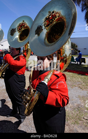 High School Band Members play tubas at Strawberry Festival Parade Plant City Florida Stock Photo
