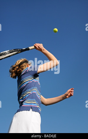 close up action shot of girl playing tennis Stock Photo