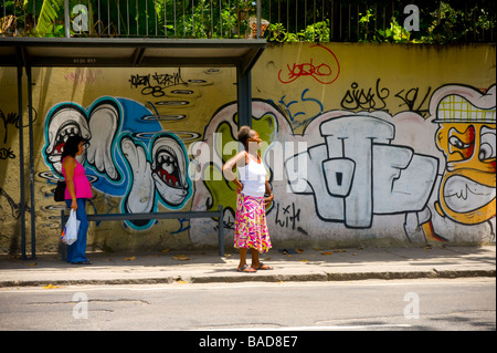 Locals waiting at a bus stop in Rio de Janeiro, Brazil. Stock Photo