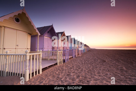 New beach huts on the island of Mersea have caused some controversy Some locals love them others hate them One way or another ev Stock Photo