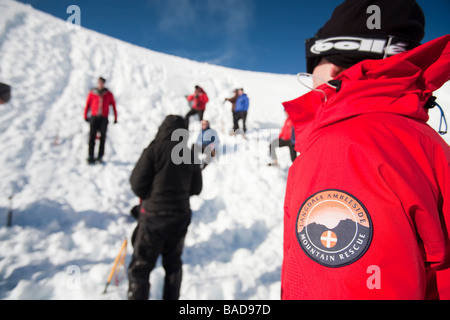 A group of mountaineers building snow holes on Cairngorm in the Cairngorm National Park in Scotland UK Stock Photo