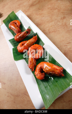 Prawn fry is a dish made by frying prawns in Oil along with chilly powder and tomato Stock Photo