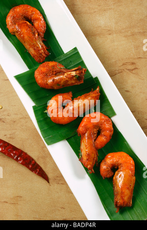 Prawn fry is a dish made by frying prawns in Oil along with chilly powder and tomato Stock Photo