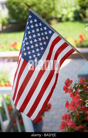 American Flag Flying From Porch Stock Photo