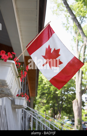 Canadian Flag Flying From Porch Stock Photo