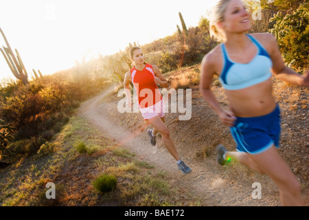 Women Running on Desert Trail, Saguaro National Park, Arizona, USA Stock Photo