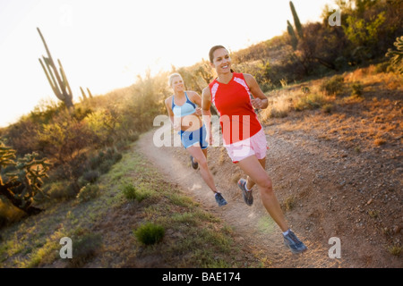 Women Running on Desert Trail, Saguaro National Park, Arizona, USA Stock Photo