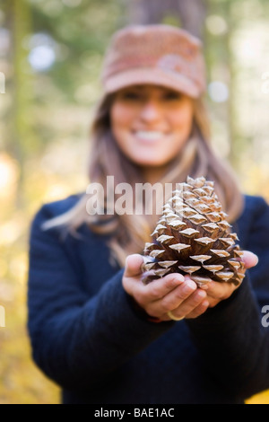 Woman Holding Cone of Ponderosa Pine Stock Photo