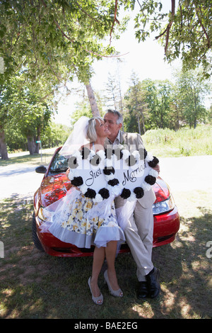 Newlyweds Holding Just Married Sign, Niagara Falls, Canada Stock Photo