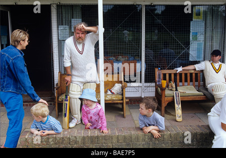 Cricketers and theor families at a village cricket match in Kent Stock Photo