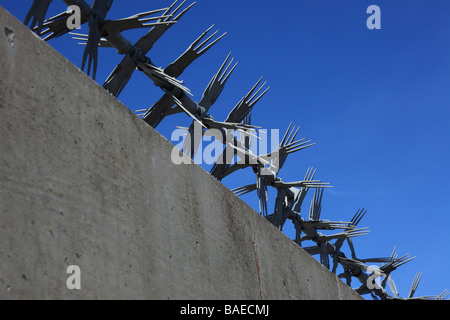 Spikes on top of wall Stock Photo