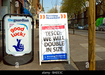tesco will double in size, announced on a street stand for london's evening standard newspaper Stock Photo