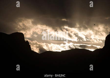 Helicopter takes off over Grand Canyon wall in Arizona, USA at dusk Stock Photo