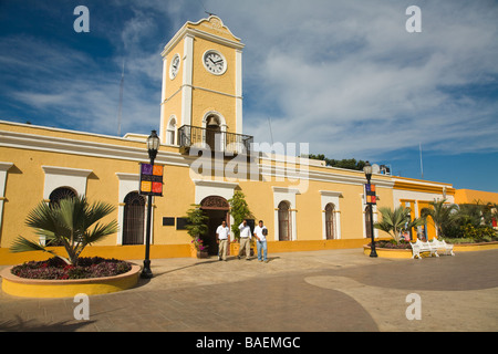 MEXICO San Jose del Cabo Clock tower entrance and exterior of city hall local government building wrought iron bench in plaza Stock Photo