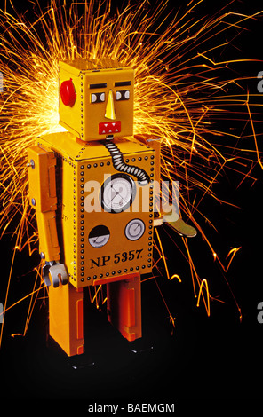 Yellow robot with sparks Stock Photo