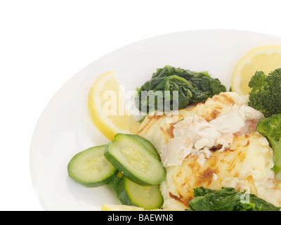 Fresh Fish Pie Topped with Mashed PotatoesWith Steamed Spinach Vegetables Meal And No People Isolated Against A White Background With A Clipping Path Stock Photo