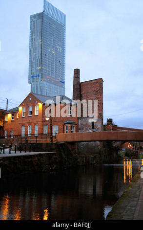 The old,lock-keepers cottage and modern Hilton hotel Beetham tower,Castlefield,the Manchester canal,evening Stock Photo