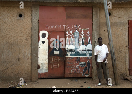 Mural painting in Banjul Gambia West Africa by member of Baye Fall sub group of muslim Mouride Brotherhood Stock Photo