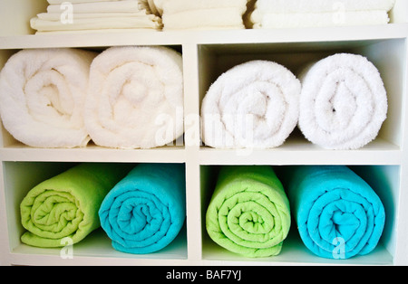 Towels and linens on shelf in Grenada Stock Photo