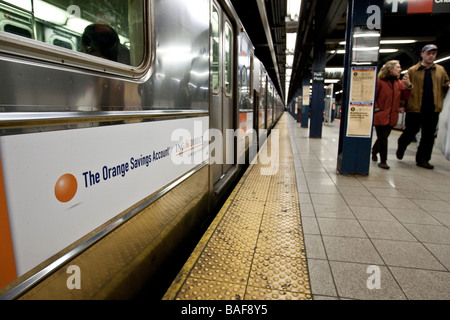 Bank advertising on side of subway car in station in New York USA 15 April 2009 Stock Photo