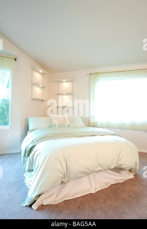 Bed in master bedroom Stock Photo