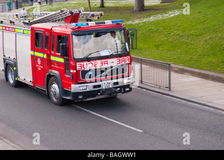 A fire engine speeding to an emergency in the Uk Stock Photo