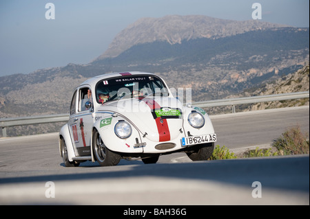 White 1965 Volkswagen Beetle classic car racing in the Classic car rally Mallorca Stock Photo