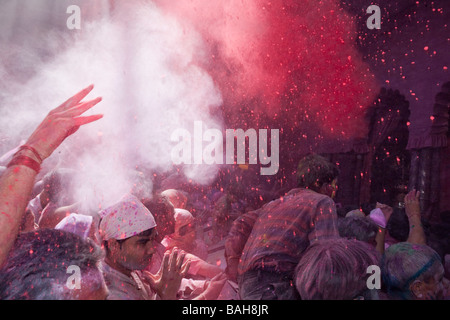 People Throwing Coloured Powder In A Hindu Temple During The Holi Festival Mathura India Stock Photo