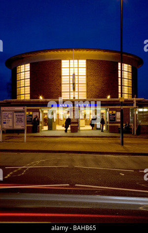 Arnos Grove Underground Station, London, United Kingdom, Charles Holden, Arnos grove underground station exterior at night. Stock Photo