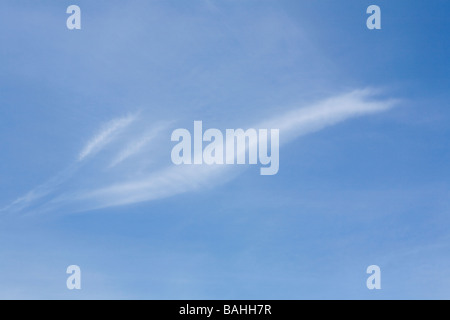 Thin wispy white Cirrus clouds in blue sky in Spring in Sussex. UK Stock Photo