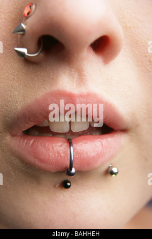 Close up of a teenage girl with lip nose and cheek piercings Stock Photo