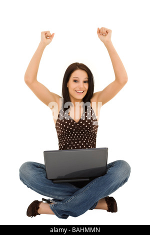 Beautiful caucasian woman sitting on a white background working on laptop computer Stock Photo