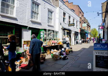 London mews , Spring in Hampstead Village , Flask Walk , bric-a-brac or curiosities or collectibles or antiques pavement shop Stock Photo