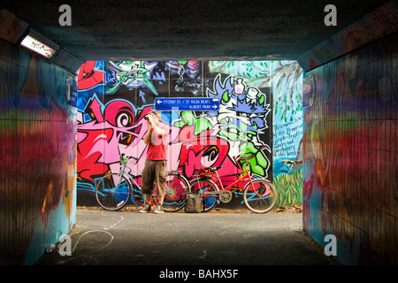 Man taking photographs of graffiti street art in ST Kilda Melbourne Stock Photo