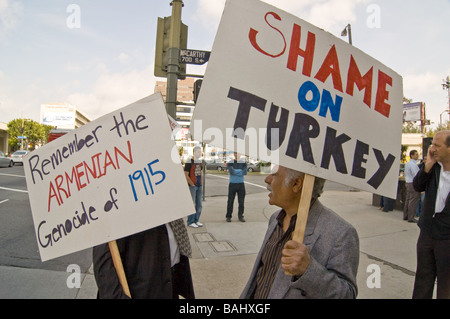 Two Armenian men hold up posters in rememberence of the Armenian genocide of 1915, Los Angeles, CA, 9/24/09 Stock Photo