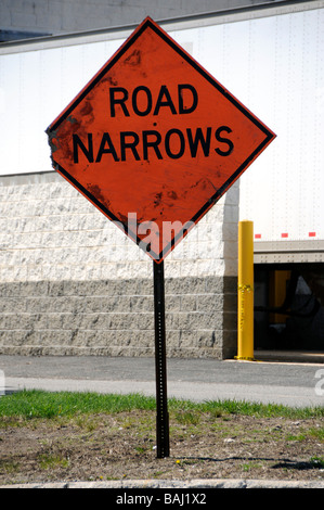 Road Narrows Warning Sign Stock Photo