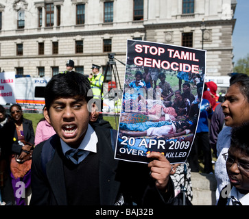 A student shouting and holding a placard at the Tamil demonstration in London.  Photo by Gordon Scammell Stock Photo