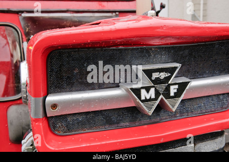 Front grille of a red vintage Massey Ferguson farm tractor Stock Photo