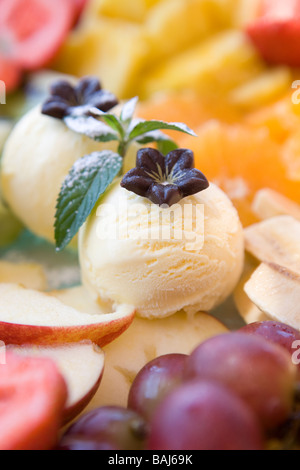 Fresh Fruit Salad with Vanilla Ice Cream Stock Photo