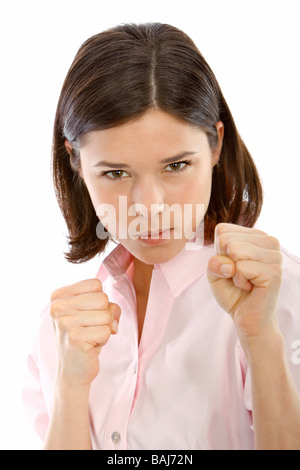 Frau fuehlt sich bedroht, young woman in fighting pose Stock Photo