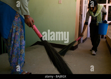 nepali girls cleaning and sweeping Stock Photo