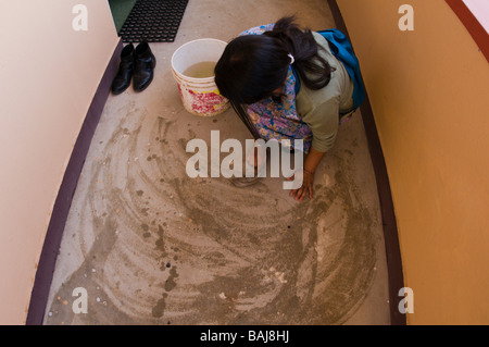 nepali girls cleaning and sweeping Stock Photo