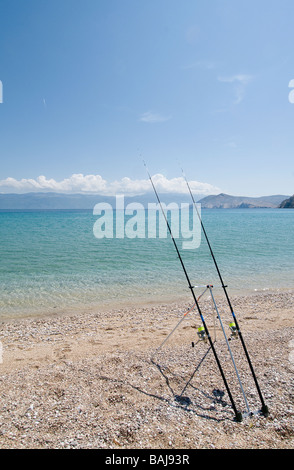 Fishing rods on the beach Stock Photo