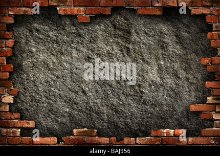 Grunge concrete wall in brick frame Stock Photo